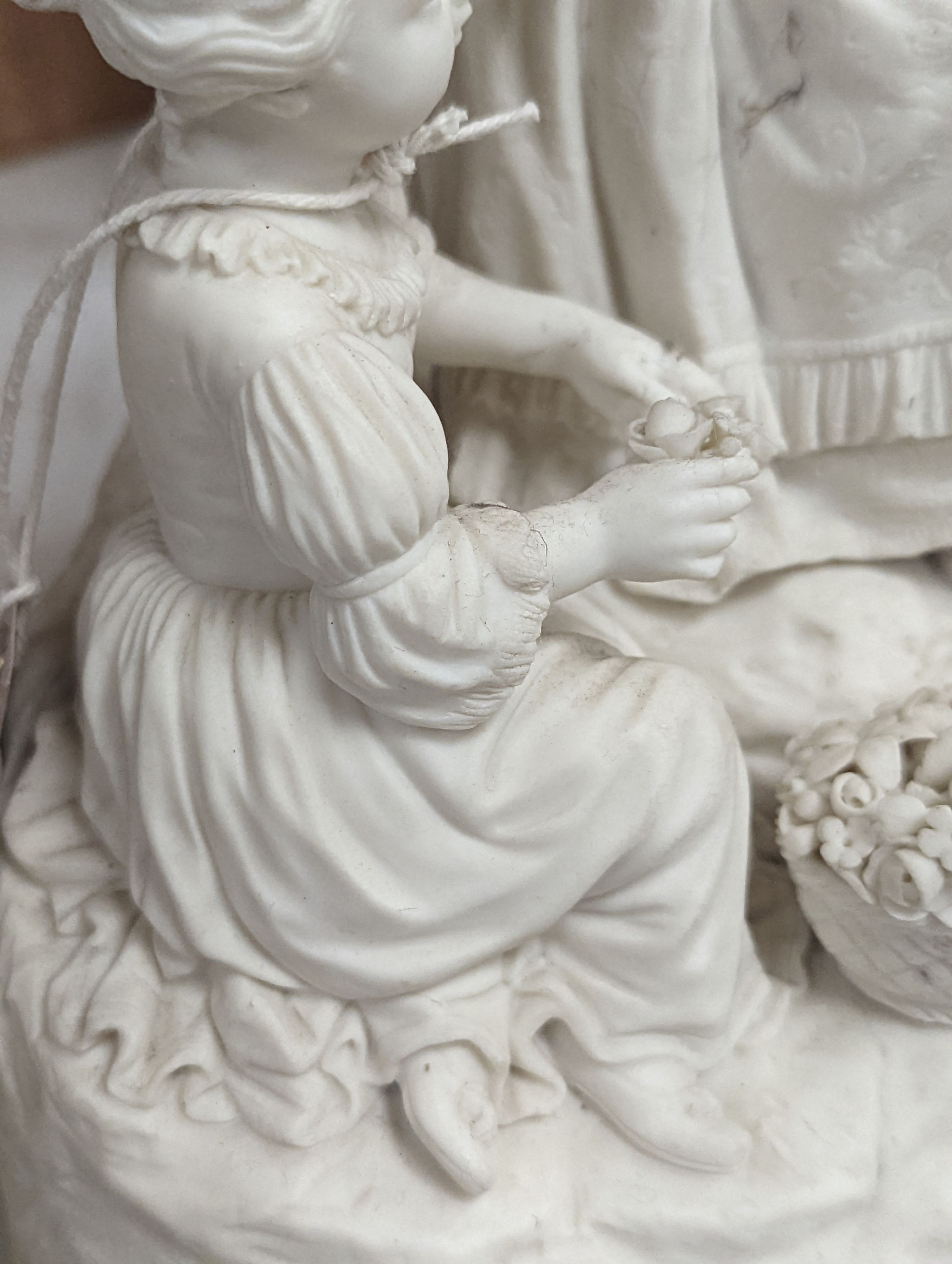 A 19th century Adams & Co. parian group of a man, woman, child and dog 31cm